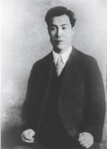 Image of Hirata wearing a suit